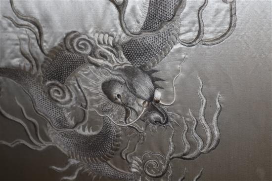 A Chinese couched and embroidered silk dragon firescreen W.69cm